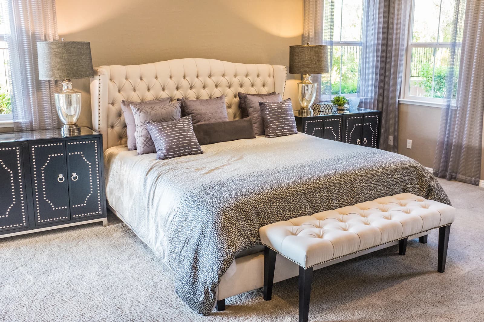 Neatly presented guest bedroom with made bed and clear surfaces